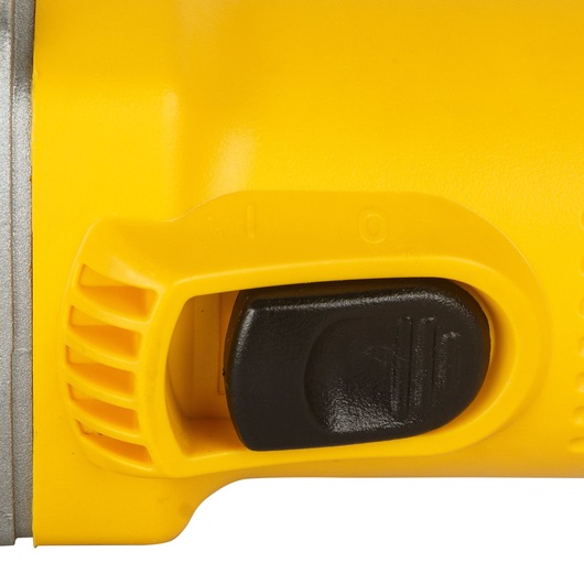 Close-up view of a yellow DEWALT power tool showing its black on-off switch.
