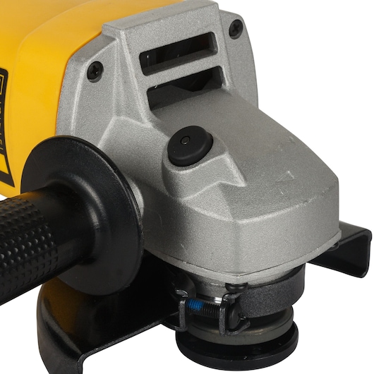 Close-up view of a DEWALT DW831 angle grinder with a silver metal casing, black handle, and yellow body.