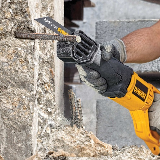 Long Life Wood Cutting Reciprocating Saw Blade being used on a metal rod.