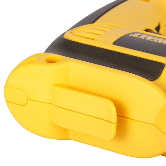 Close-up of a yellow and black DEWALT power tool handle, showing a side clip and part of the ergonomic grip.