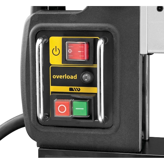 Close-up view of a DEWALT control panel featuring buttons, including a power button, overload indicator, and red and green start/stop switches.