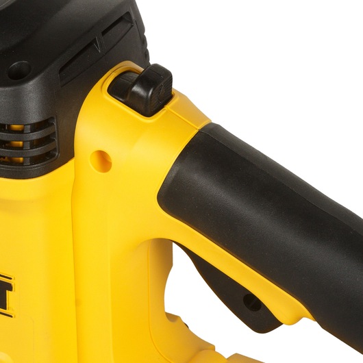 Close-up image of a DEWALT power tool handle, showing the yellow and black design as well as a switch on the top.