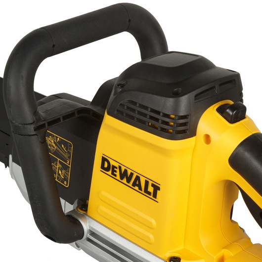 Close-up image of a DEWALT power tool, showing the yellow and black body and handle. The product label and ventilation grilles are visible, as well as safety instructions on the side.