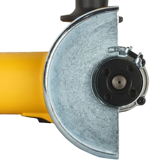 Close-up view of a DEWALT DWE4215 angle grinder, showing the metal guard and spindle without the cutting wheel.