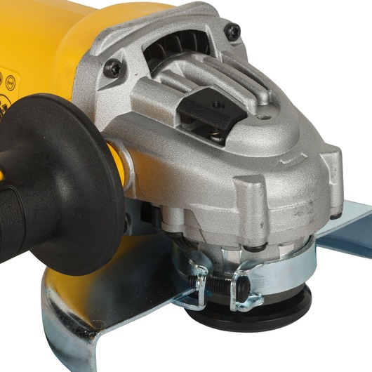 Close-up view of a DEWALT DWE4215 angle grinder, showing the metal housing, side handle, and blade guard.