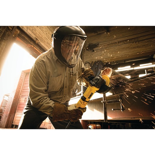 High performance trigger switch grinder with nolock on being used by a person.