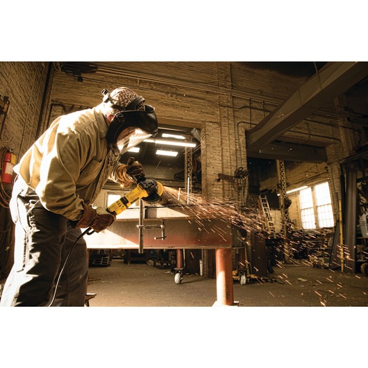 High performance trigger switch grinder with nolock on being used by a person.