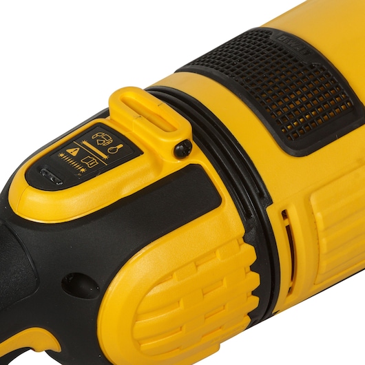 Close-up view of a DEWALT DWE4579 power tool showing the yellow and black casing and the control panel with icons and ventilation grilles.
