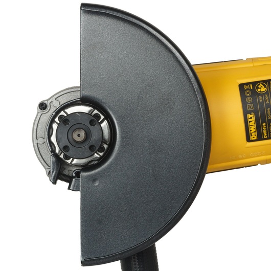 Close-up image of a DEWALT DWE496 angle grinder with a yellow handle and a black protective guard.