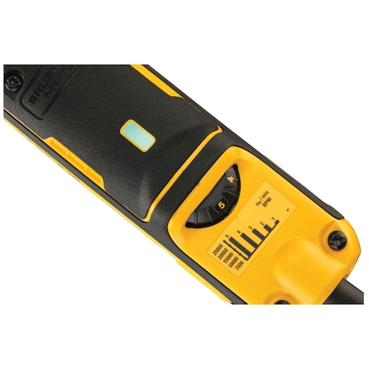 Close-up view of a DEWALT power tool handle featuring a speed control dial and RPM chart, with a yellow and black color scheme.