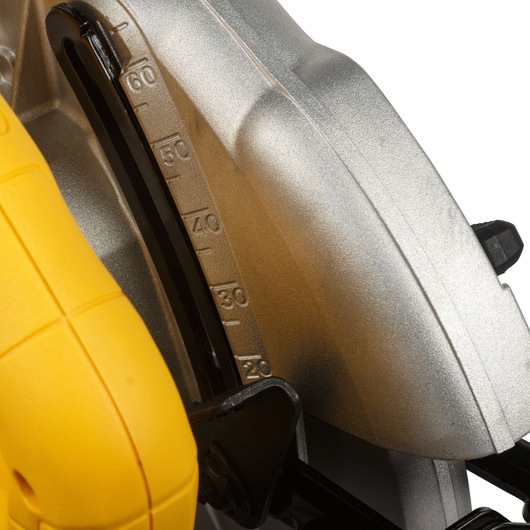 Close-up view of a Dewalt circular saw showing the bevel adjustment scale, with a yellow handle and metallic blade guard.