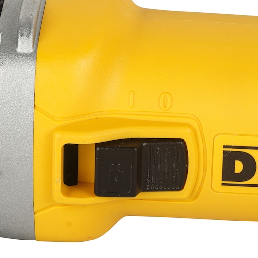 DEWALT DWE8300S yellow tool handle with black safety lock switch, close-up photo, photography category.