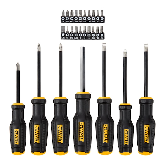 A set of DEWALT screwdrivers with black and yellow handles, displayed in a row. Above the screwdrivers, there are two black racks containing a variety of interchangeable screwdriver bits with labeled sizes and types.