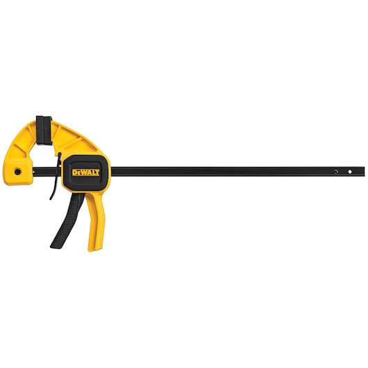 A DEWALT trigger clamp with a yellow and black body, featuring a long metal bar and a handle for manual adjustment. The clamp is designed for securing materials during woodworking or similar tasks.