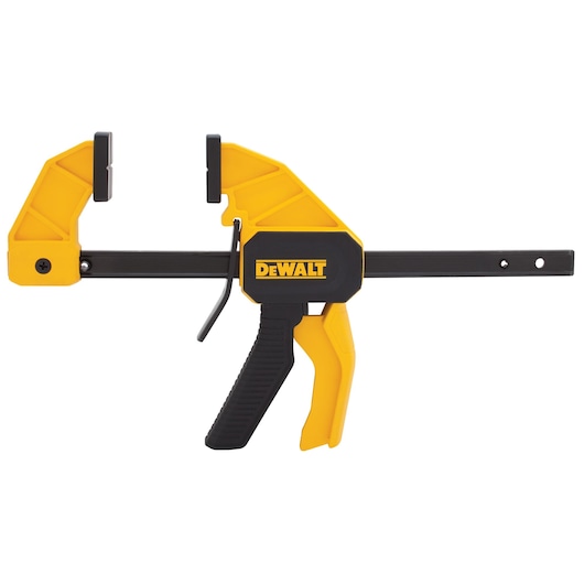 A DEWALT yellow and black bar clamp with a trigger handle and adjustable jaw for securing materials during photography or woodworking tasks.