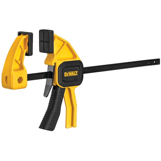 A DEWALT trigger clamp with a yellow and black body, designed for securing materials during woodworking or other tasks. The clamp features a pistol-grip handle for easy operation.