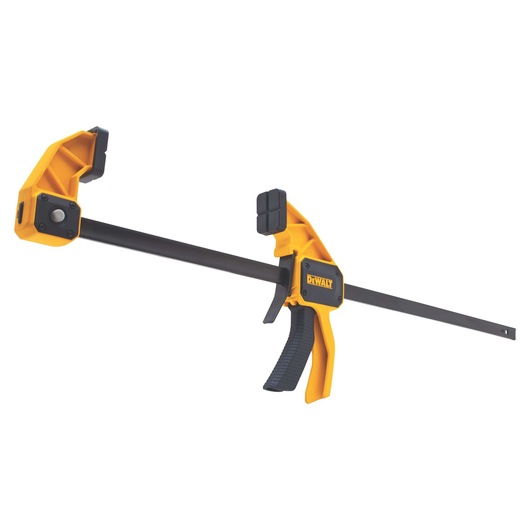 A DEWALT trigger clamp with yellow and black design, used for holding materials securely in place during woodworking or construction projects.