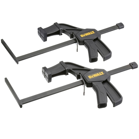 Two DEWALT quick-release clamps with black handles and jaws, designed for securing workpieces during photography tasks.