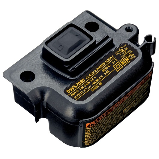 A DEWALT DWS7085 class 2 power supply unit, black plastic, with a prominent switch and safety labels including voltage and certification details.
