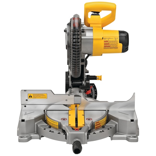 Front view of a DEWALT DWS713 miter saw with a yellow handle and safety warnings visible on its base. The saw is designed for precise cutting tasks in woodworking and construction.