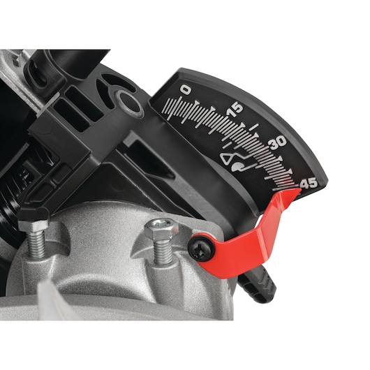 Close-up of a DEWALT miter saw angle adjustment gauge, showing a black and white angle scale marked from 0 to 45 degrees, with a red lever for making precise adjustments.