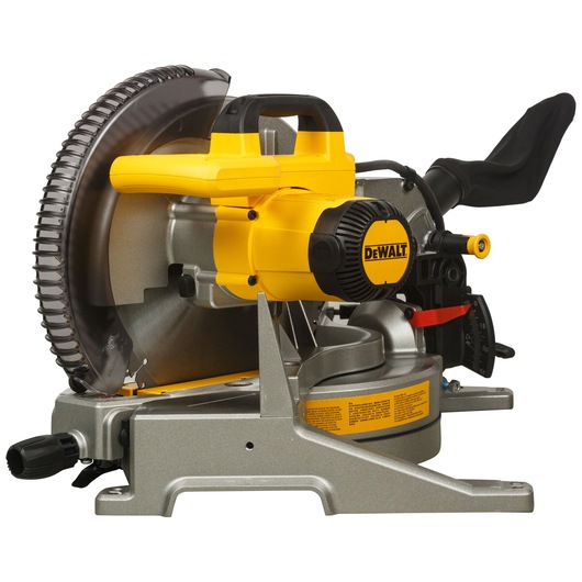 A DEWALT DWS715 compound miter saw, featuring a yellow and black design, with a circular blade and sturdy base. The saw is positioned side-on, showcasing its handle, blade guard, and adjustment features.