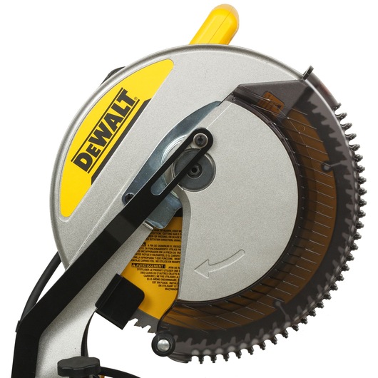 Close-up view of a DEWALT DWS715 compound miter saw blade with safety guard, showing the brand logo in yellow and black.