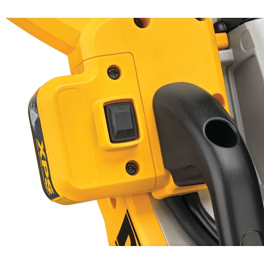 Close-up view of a yellow DEWALT power tool featuring an on/off switch, black handle, and XPS marking.
