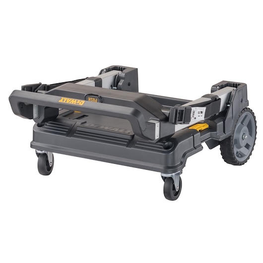 Folded DEWALT DWST17888 rolling trolley with large wheels and sturdy plastic frame, designed for transporting toolboxes and equipment.