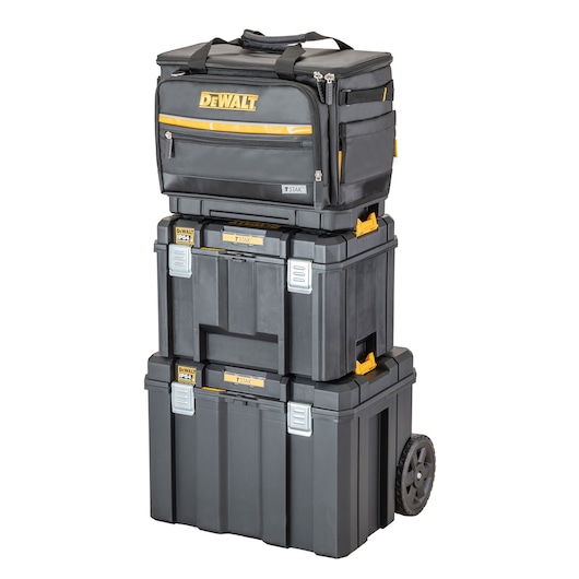 Stack of DEWALT TSTAK storage organizers and toolboxes, including a wheeled toolbox at the bottom, two stackable boxes in the middle, and a soft-sided organizer bag on top, all in black and yellow.
