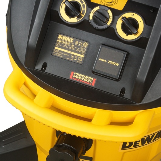 Close-up of a DEWALT DWV902M-QS industrial vacuum cleaner control panel, showing power settings, labels, and a yellow and black color scheme.
