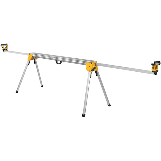 A DEWALT DWX723 aluminum miter saw stand, featuring a long silver frame with folding legs and yellow brackets at each end.