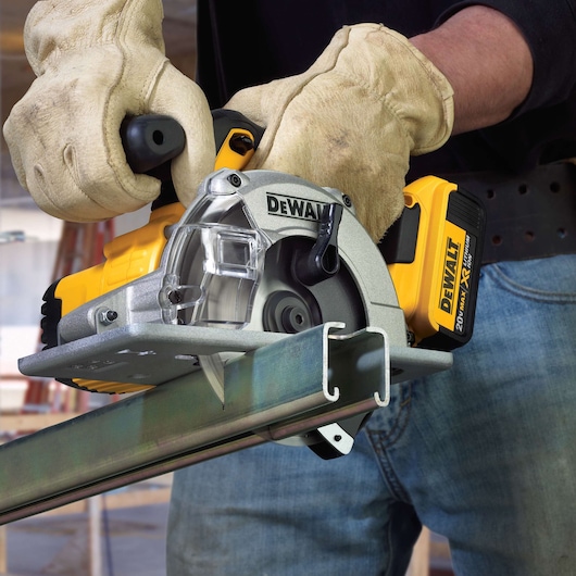 Lithium Ion Metal Cutting Circular Saw being used by worker to cut strut channel