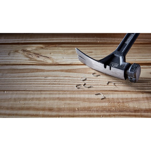 Pin remover feature of a 20 ounce steel rip claw nailing hammer.