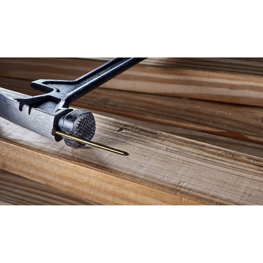 Nail holder feature for precise application of a 22 ounce demolition hammer.