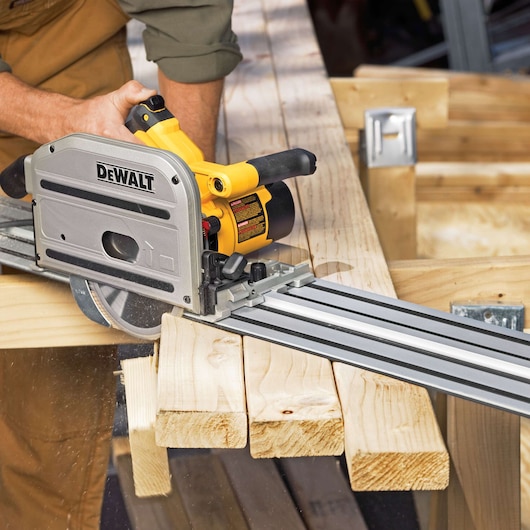 track saw kit being used to cut wood.